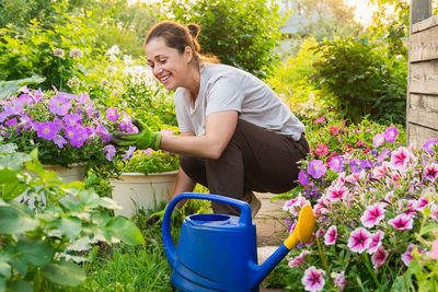 Young woman gardening in yard