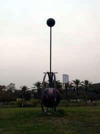 Horse cart on field against sky