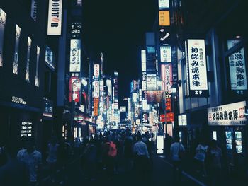 Group of people in city at night