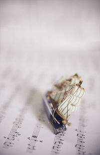 Close-up of toy boat on paper