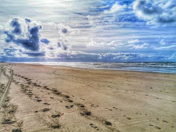 Scenic view of beach against sky