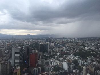 High angle view of buildings in city against sky