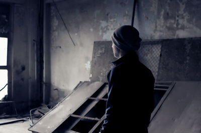 Man standing in abandoned building