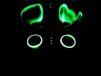 Close-up of illuminated light painting against black background