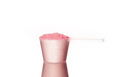 Close-up of drink against white background