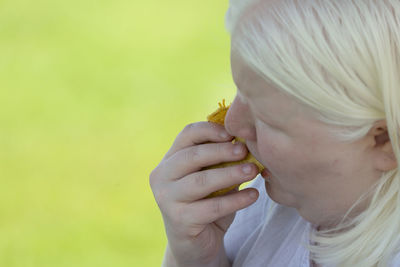 Close-up of woman eating food