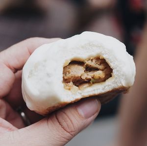 Cropped image of person holding fresh sweet food