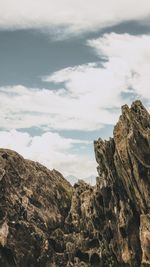 Low angle view of rock formations against sky