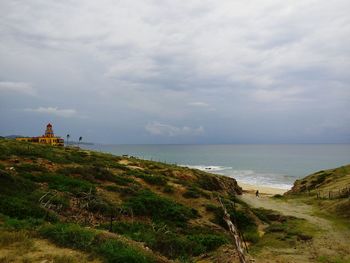 Scenic view of sea against cloudy sky