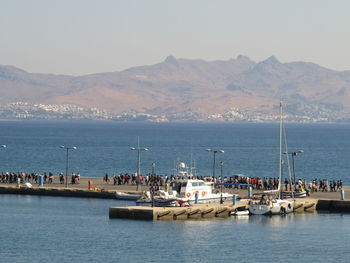 Scenic view of sea with mountains in background