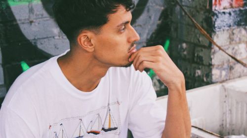 Close-up of young man holding camera