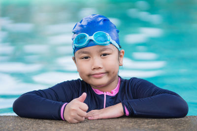 Portrait of young woman in swimming pool