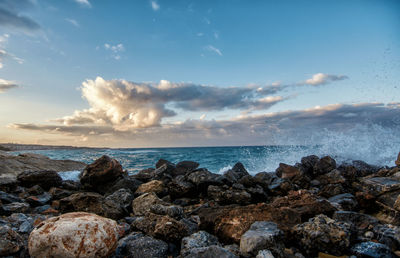 Scenic view of sea against cloudy sky