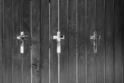 Full frame shot of cross shapes on wooden wall
