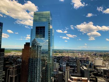 Modern buildings in city against sky