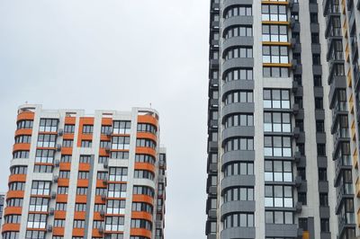 Low angle view of buildings in city against sky