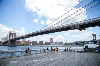 Bridge over river with city in background