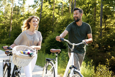 Side view of woman riding bicycle