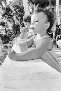 Boy sitting in bathtub