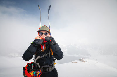 Mountaineer backcountry skiing skiing woman climber in the mountains. ski tourism in the alpine