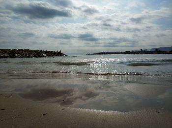 Scenic view of beach against sky