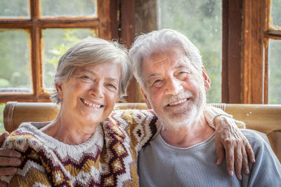 Portrait of couple sitting at home