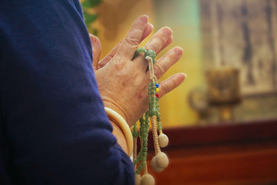 Cropped image of woman praying