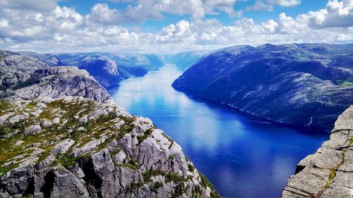 Panoramic view of river amidst mountains against sky