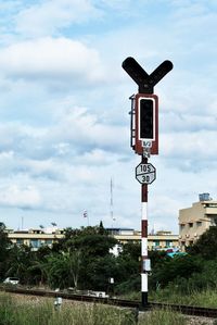 Railway signal against sky