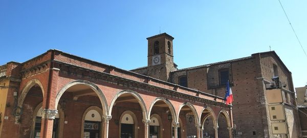 Low angle view of historical building against blue sky