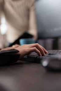 Midsection of man using laptop