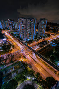 High angle view of illuminated city street at night