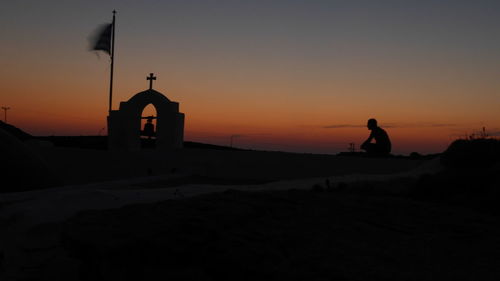 Silhouette of people at sunset