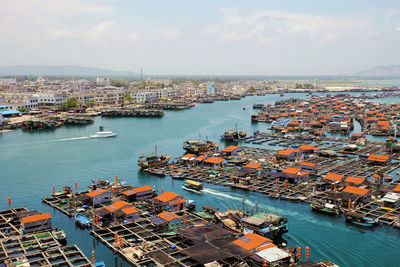 Boats moored at harbor