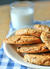 Close-up of chocolate cookies with milk on table