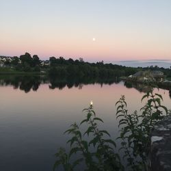 Scenic view of lake against sky during sunset