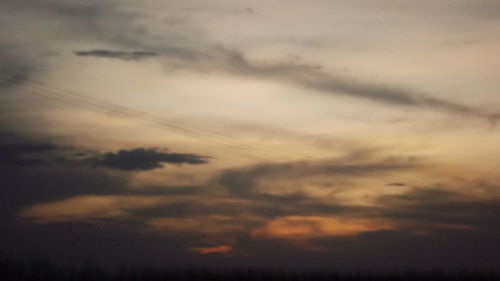Low angle view of dramatic sky during sunset