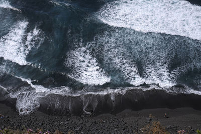 El ancón, tenerife, black sand beach with waves