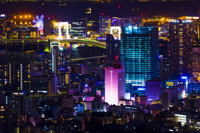 Illuminated modern buildings in city at night