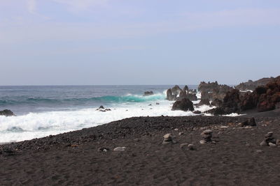 Scenic view of beach against clear sky