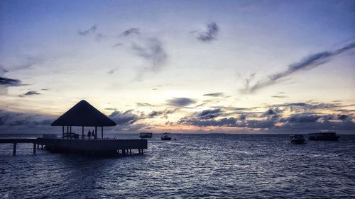 Scenic view of sea against sky at sunset