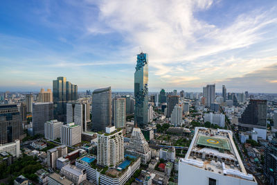 Aerial view of modern buildings in city against sky