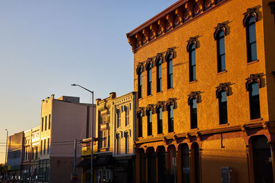 Low angle view of buildings against clear sky