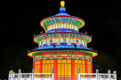 Illuminated traditional building at night