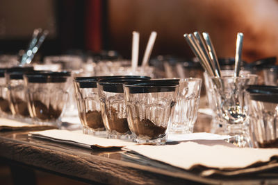 Close-up of wine glasses on table