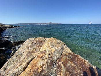 Scenic view of sea against clear blue sky