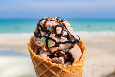 Close-up of ice cream on beach