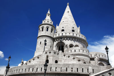 Low angle view of historical building against blue sky