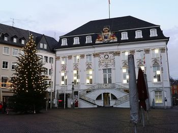 View of illuminated building against sky in city