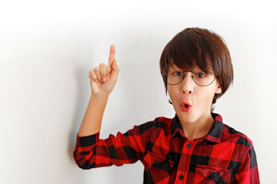 Portrait of boy against white background